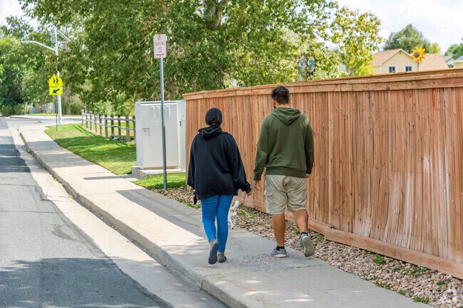 Residents take a stroll on the sidewalks in Quail Ridge-Adams.