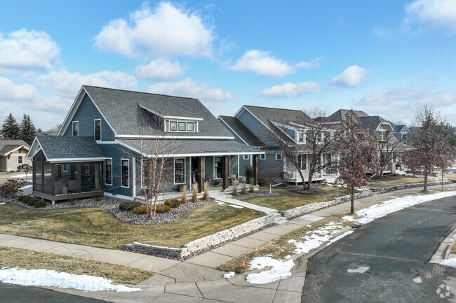 Cobblestone Lake has rows of craftsman style homes lined along the sidewalk.