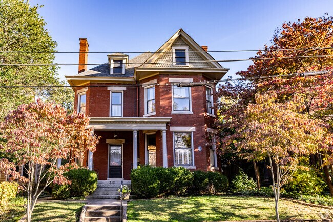 A beautiful Victorian four square home with lush landscaping in the Historic Western Suburb
