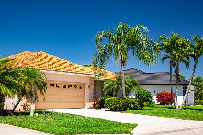 Homes in Lely Resort are nicely appointed with tropical landscaping and manicured lawns.