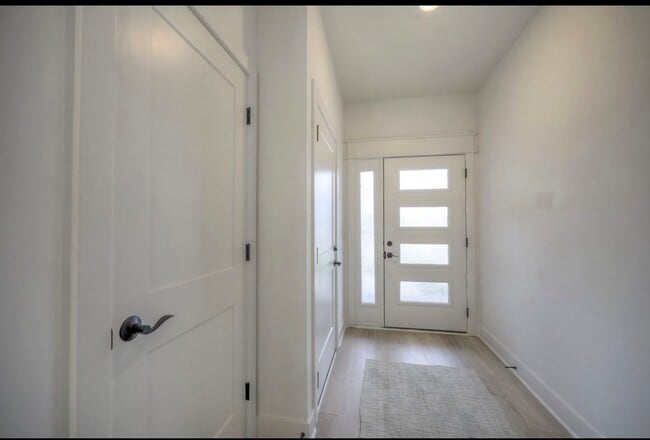 Elegant front door with contemporary detailing, offering a stylish first impression and enhanced cur