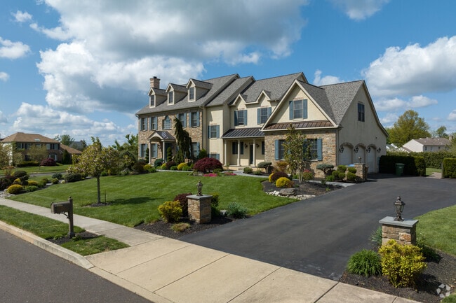 Maple Glen offers many large single-family homes with well-maintained front lawns.