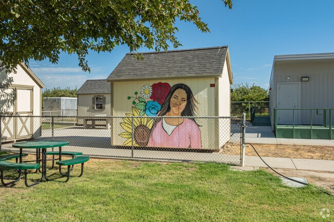 A beautiful mural is featured on a storage room wall at Burrel Elementary School.