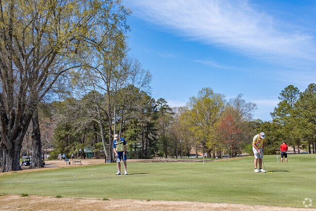 Friends from Forest Oaks meet up at the country club for a friendly round.