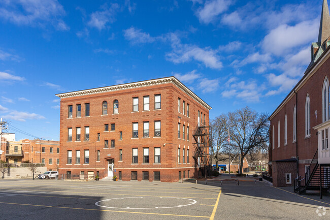 The play courts and backside of the St. Charles Elementary School in Woburn, MA.