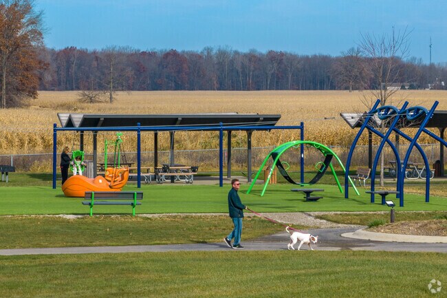 Kids play and people walk their dogs in Lenox Township.