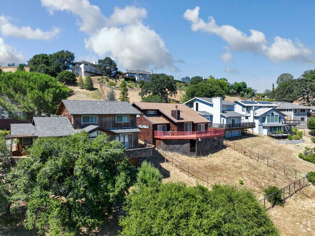 A row of hilltop homes in Ignacio have inclined backyards.