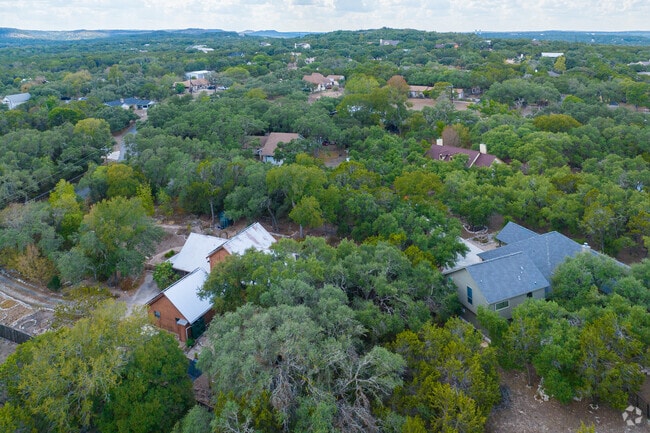 Wimberley Hills, perched amid rolling terrain and embraced by majestic trees.