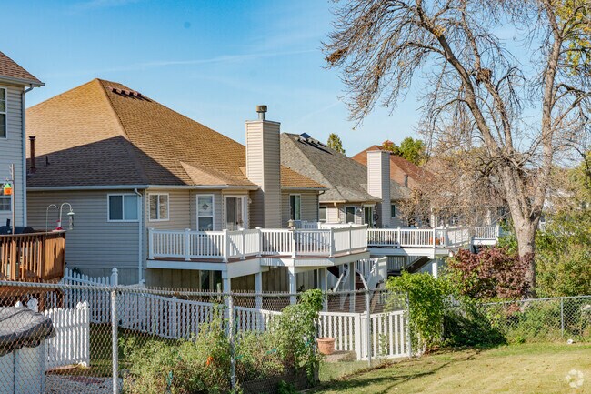 Many homes in Lemay have backyards with wooden porches.