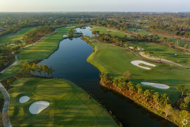 Aerial image over the fairways and lakes in the Royal Poinciana Golf Course