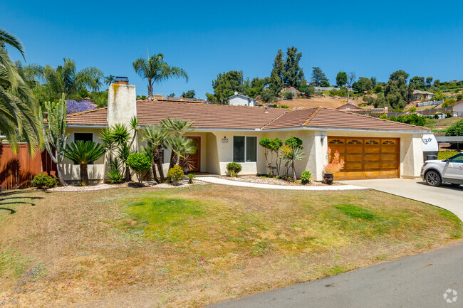 A ranch style home nestled into the hilly landscape in Rancho Park.