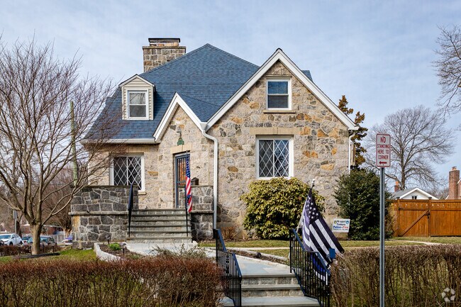 A single-family Cape Cod home maintains a neat yard in Nepera Park, Yonkers.