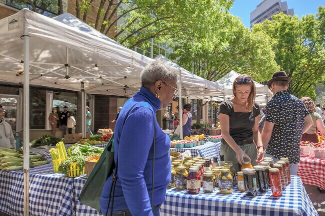 Shoppers are naturally drawn to beautiful strawberries on display at Soda City Market.