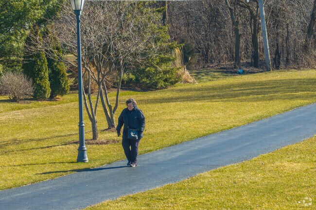 A Countryside resident enjoys a walk through Countryside Park.