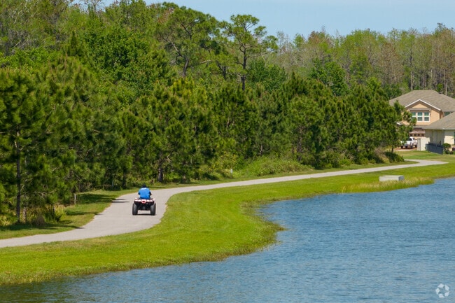 ATV riding along a path in Tapestry.
