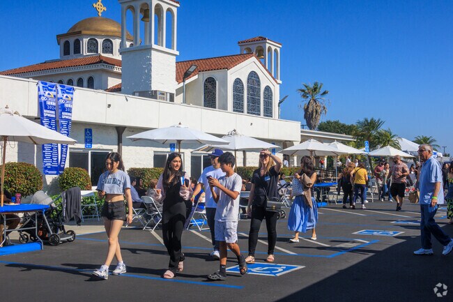 Patrons make their way around the grounds at the annual OC Greek Fest in Northwest Anaheim.