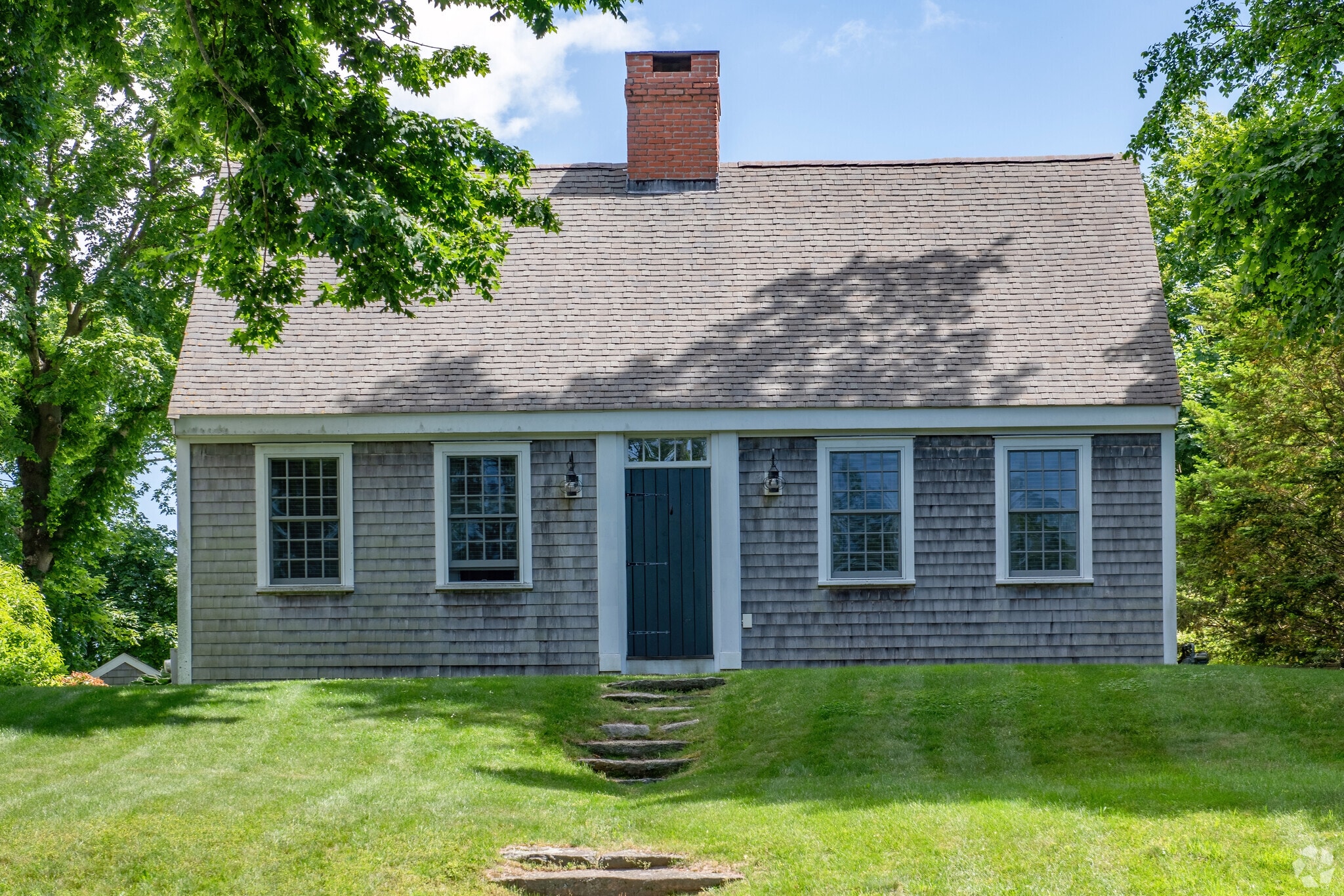 Perched on a hill above the village center, an historic Cape Cod home is part of Barnstable.