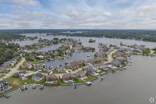 An aerial overview highlights the reservoir and the homes surrounding it in Geist.