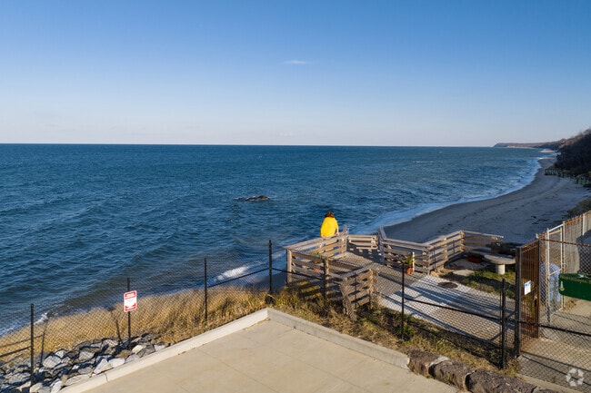 Scotts Beach has stair access to walk along the water in Sound Beach.