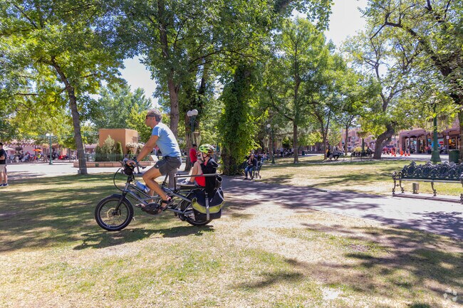 Visitors and residents can rent bikes and ride along the plaza in Glorieta.