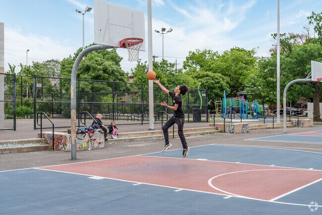 After-school pickup basketball games are popular at Fairhill's Jose Manuel Collazo Park.