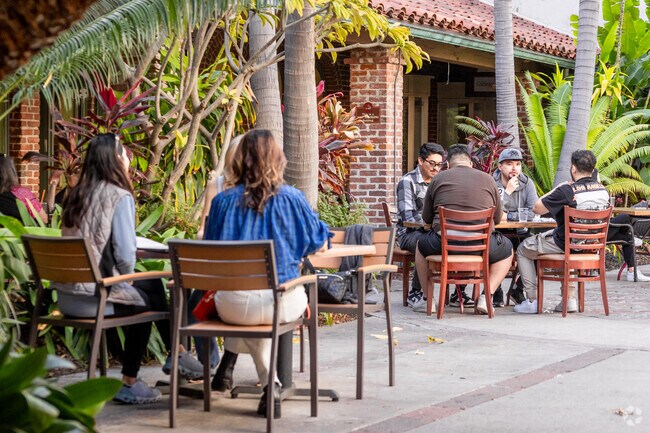 Downtown Fullerton has cafes amidst old brick buildings and palm trees.