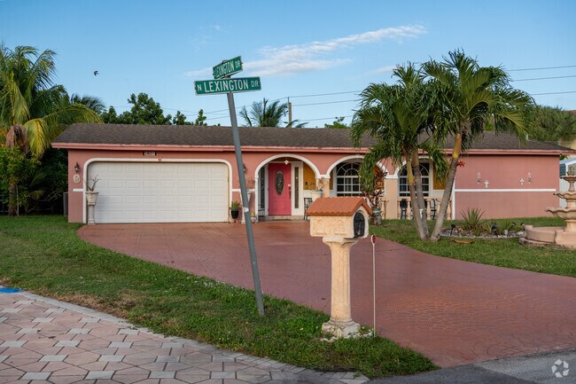 This beautiful bungalow stands at the corner where North and East Lexington Drive meet.