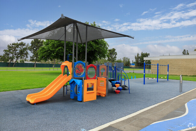 Juarez Academy's campus features a vibrant playground for students in Cerritos.