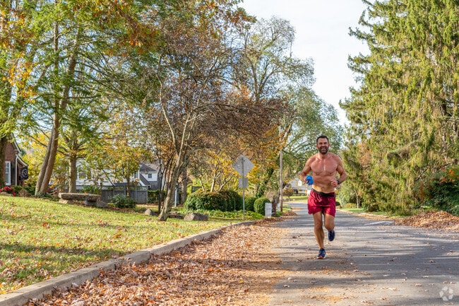A local enjoys a run on a Johnson City street, located near Oak Grove.