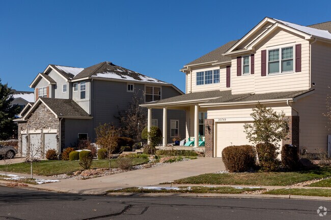 Looking down the street at the Craftsman homes with large yards in Greenfield.