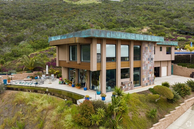 Modern homes with stone siding and luxurious pools can be found in Vista Valley.