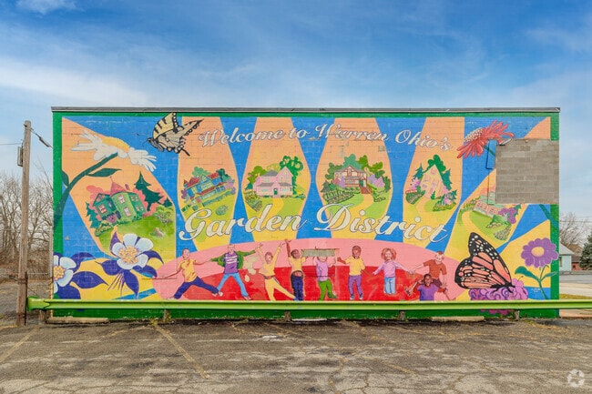A whimsical painting welcoming everyone to the Garden district in Central City.