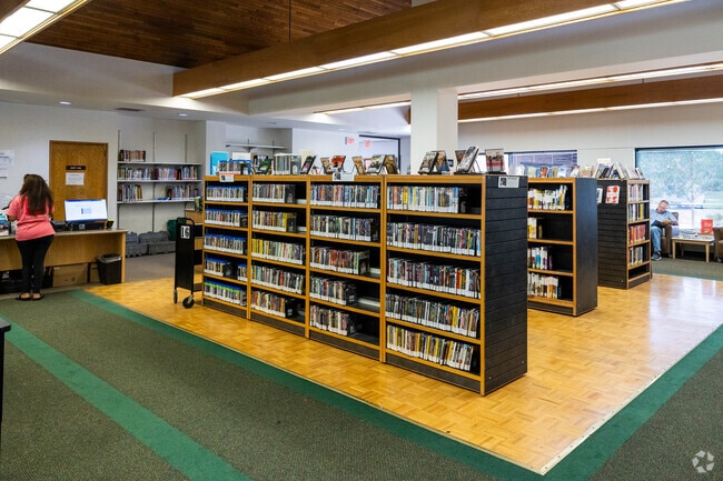 Check out your favorite books or movies at Rockwell Branch of Public Library in New Day.