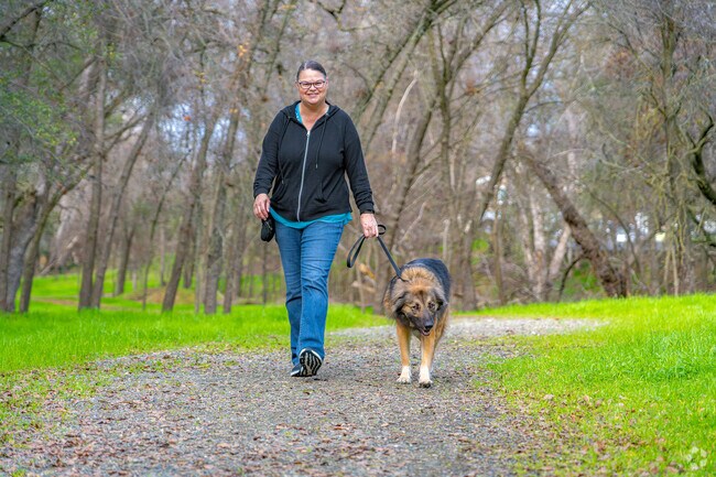 Woman enjoys the beautiful scenery through Sunset East Park in Sunset Creekside.