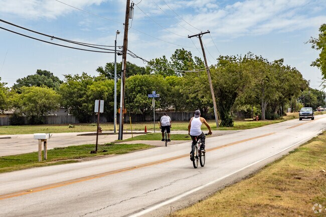 In Everman, county roads are commonly utilized by both cyclists and motorists.