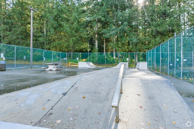 Residents of Key Center ride to Volunteer Park and land tricks at the skate area.