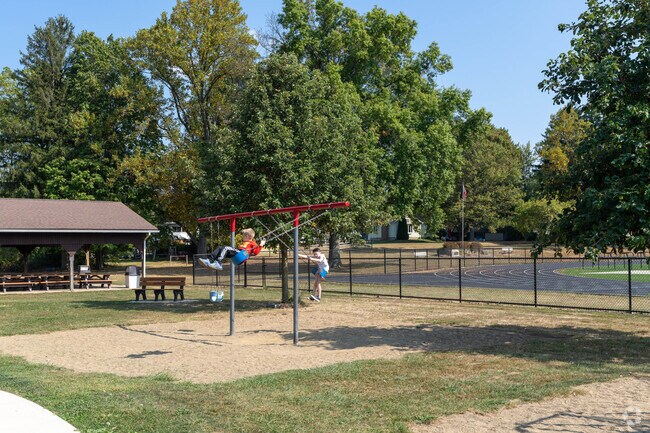 Doylestown children enjoy the swings at Doylestown Memorial Park.