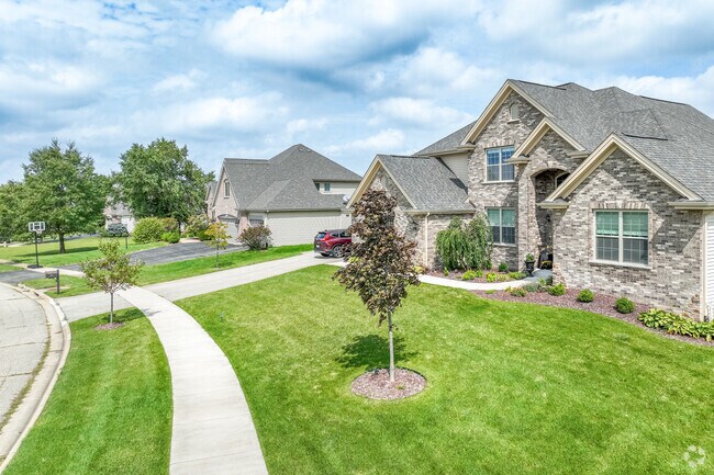 Rows of stone custom homes are located all over Bello Reserve.