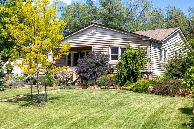 Ranch-style homes with manicured lawns line the streets of Ivywild, Colorado Springs.