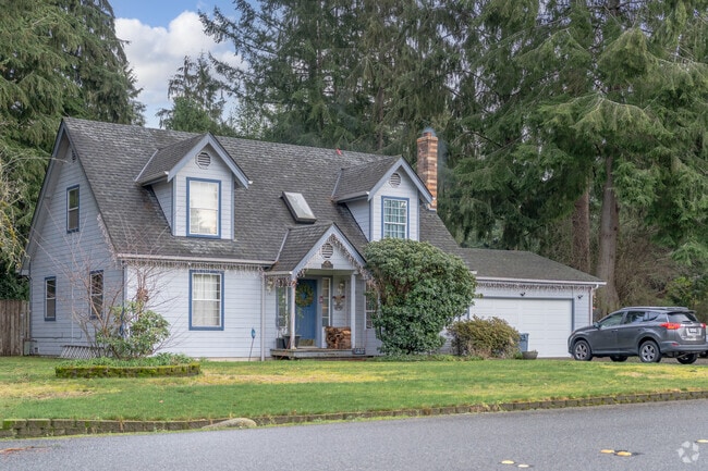 Find your oasis of calm and comfort in this meticulously crafted Woods Creek home.