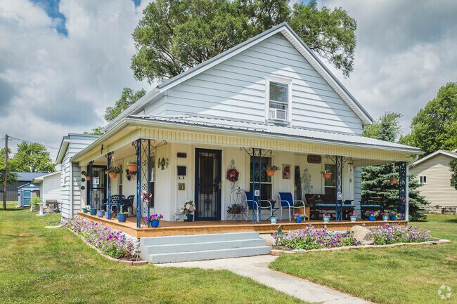 This Delphos home features a covered front porch to enjoy the outdoors rain or shine.
