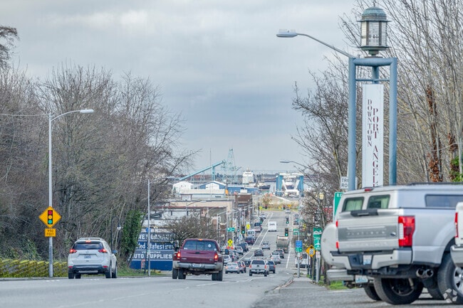 Driving into Port Angeles offers views of the water and ornate welcome signs.