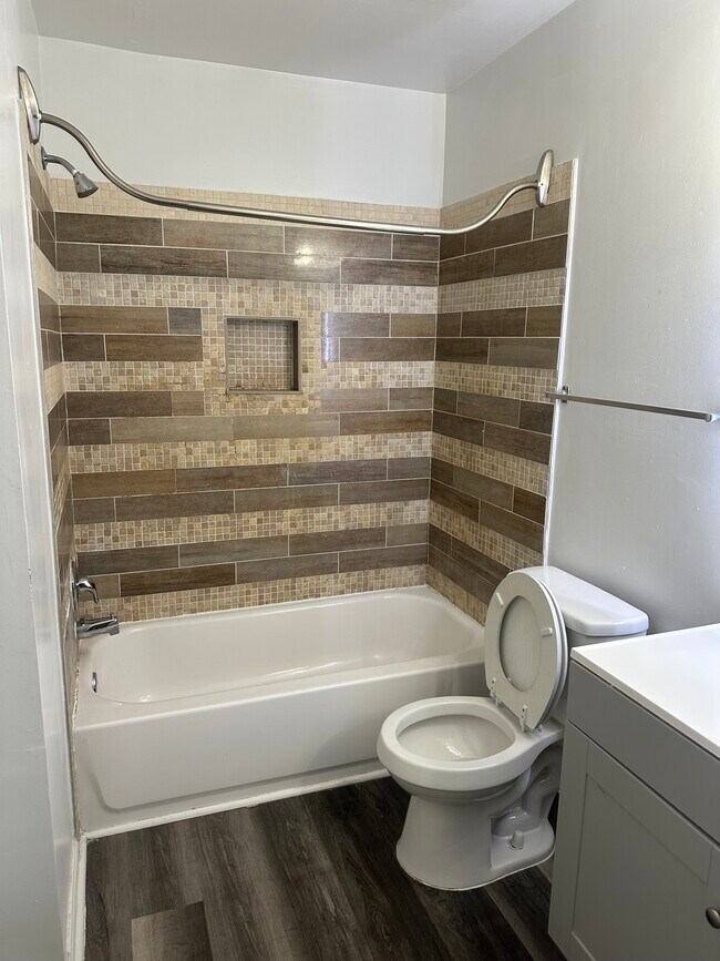 Hall bath with linen closet and lighted mirror
