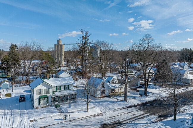 A row of homes in Leslie with the grain elevators in the background.