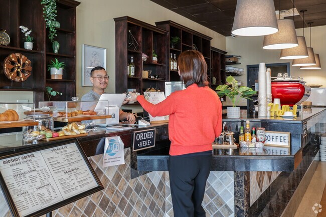 Kingsbrooke locals grab coffee and pastries at GodShot Coffee to start their day.