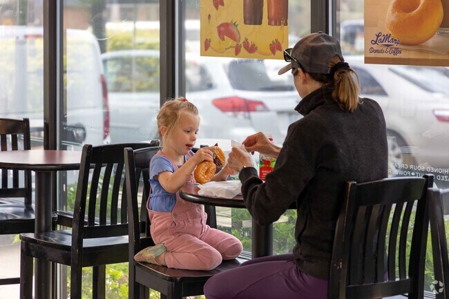All the homes in Woodwest are within a mile of the Cimarron Plaza, home to a handful of local businesses like LaMar’s Donuts and Coffee.
