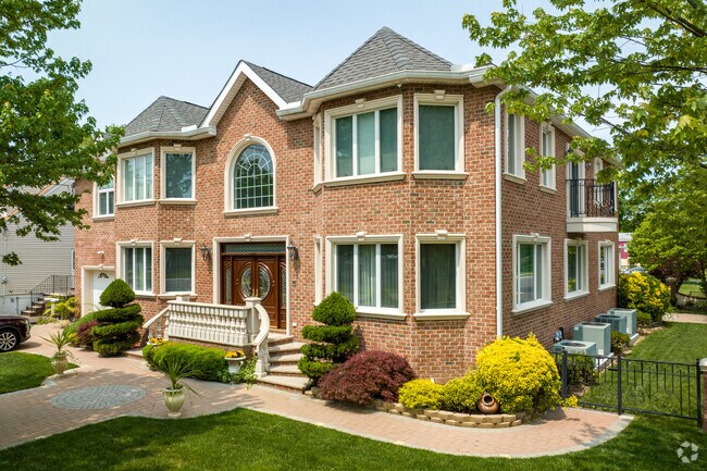 Enjoy the best of living in beautiful brick colonial in Secaucus.