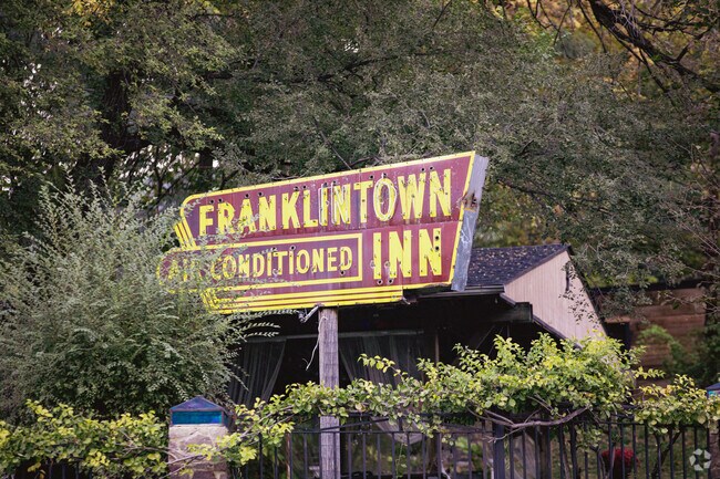 The Franklintown Inn hosts private events with a patio, yard, and vintage sign.
