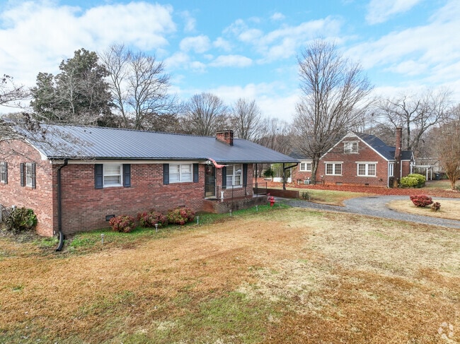 A row of brick ranch homes in Harmony.