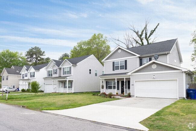 Glenrock features rows of new traditional-style homes with tidy lawns.